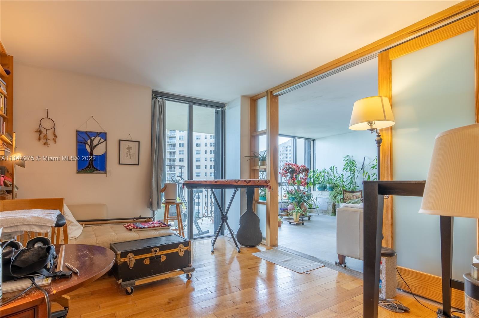 520 Brickell Key Drive, Unit A913 Miami, FL 33131 - Photo 8 of 18 a living room with furniture and a table