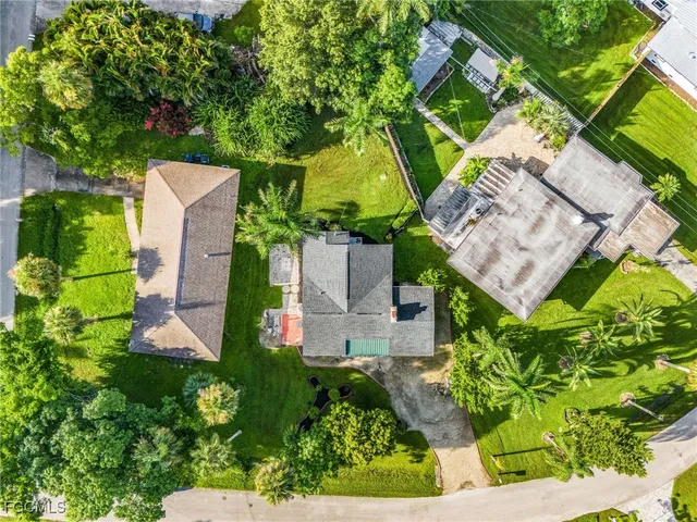 an aerial view of a house with a garden and plants