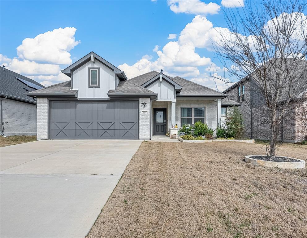 634 Cherry Hill Road Red Oak, TX 75154 - Photo 1 of 1 View of front of house with a garage and a front yard