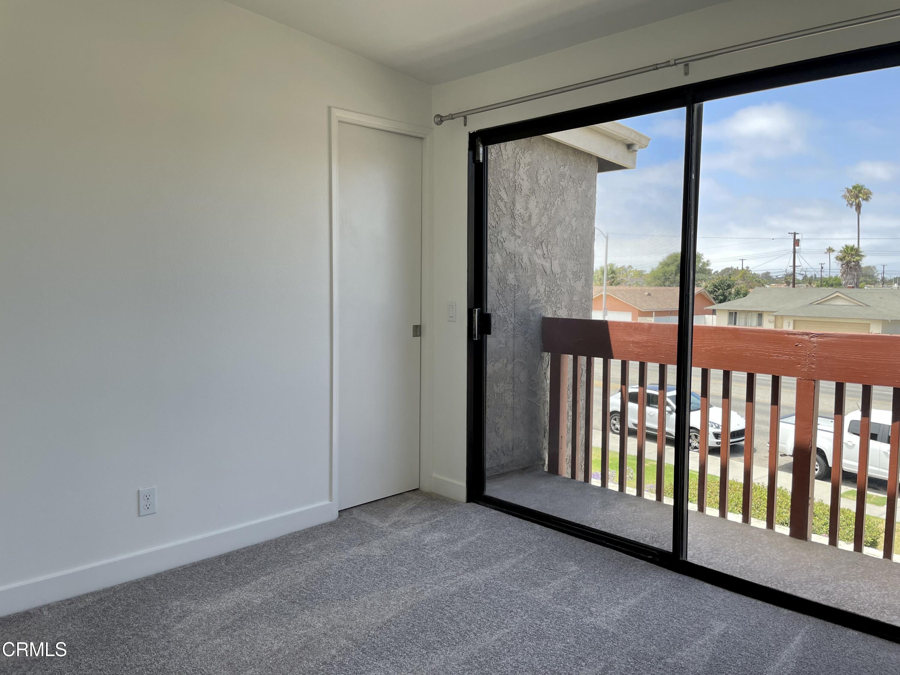 5115 Perkins Road Oxnard, CA 93033 - Photo 19 of 25 a view of a porch with a floor to ceiling window