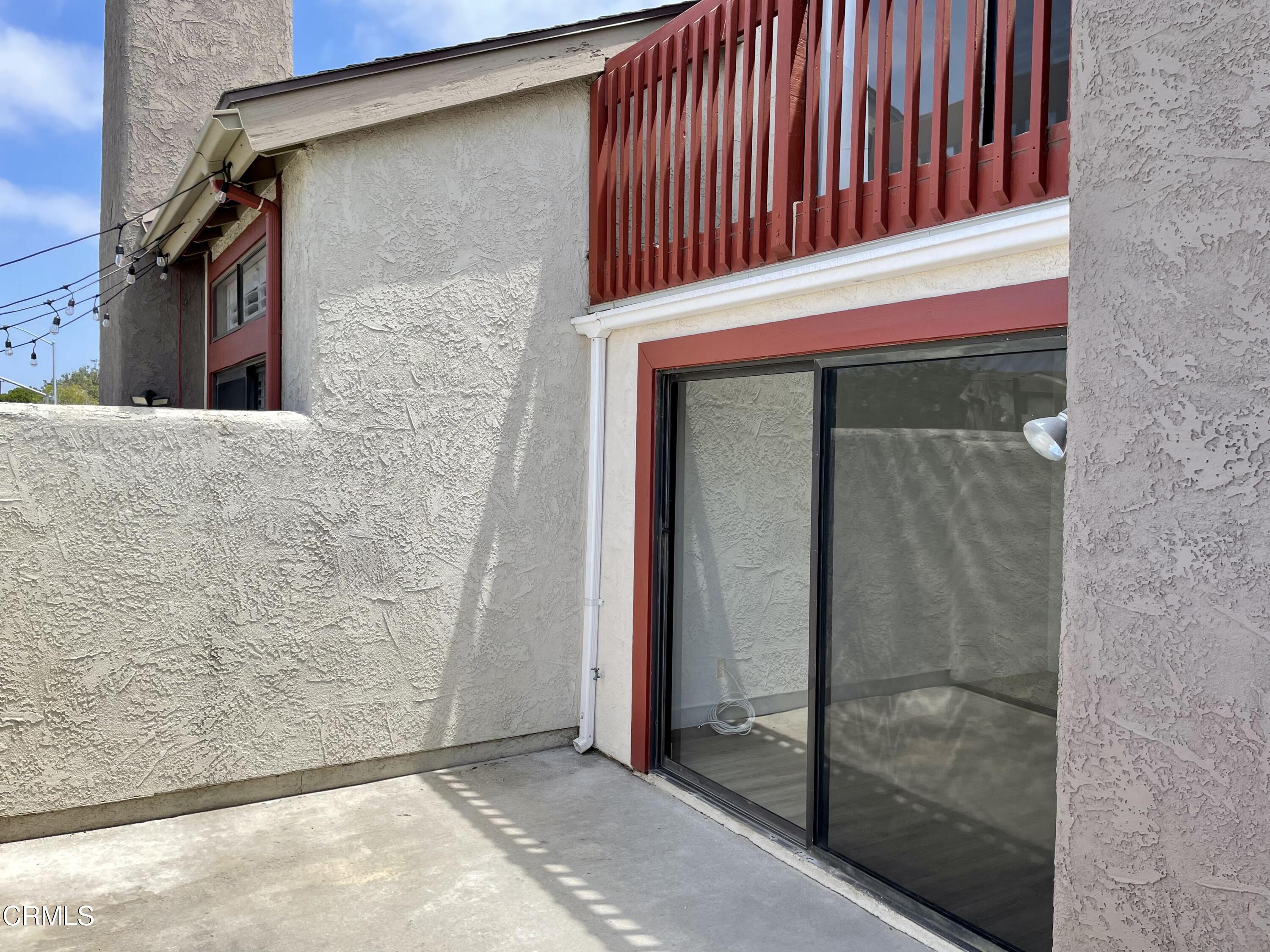 5115 Perkins Road Oxnard, CA 93033 - Photo 22 of 25 a front view of a house with a glass door