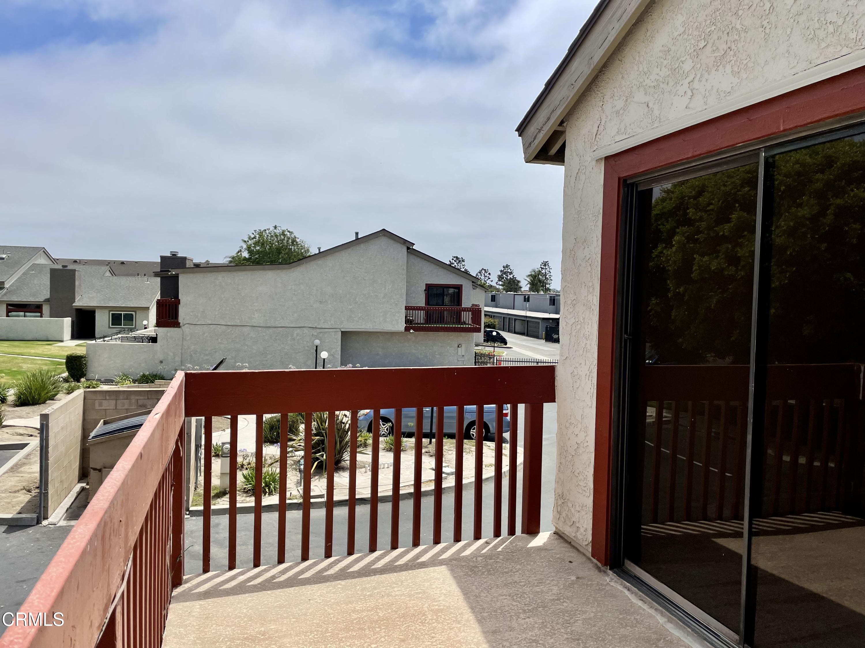 5115 Perkins Road Oxnard, CA 93033 - Photo 23 of 25 a side view of a house with a balcony