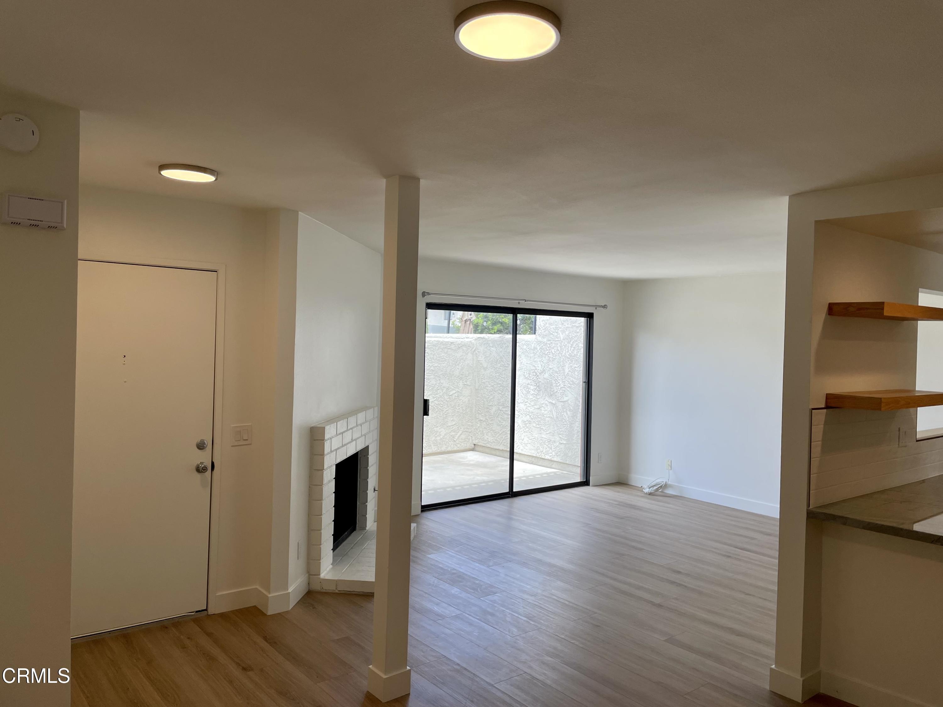 5115 Perkins Road Oxnard, CA 93033 - Photo 4 of 25 a view of empty room with wooden floor and fan