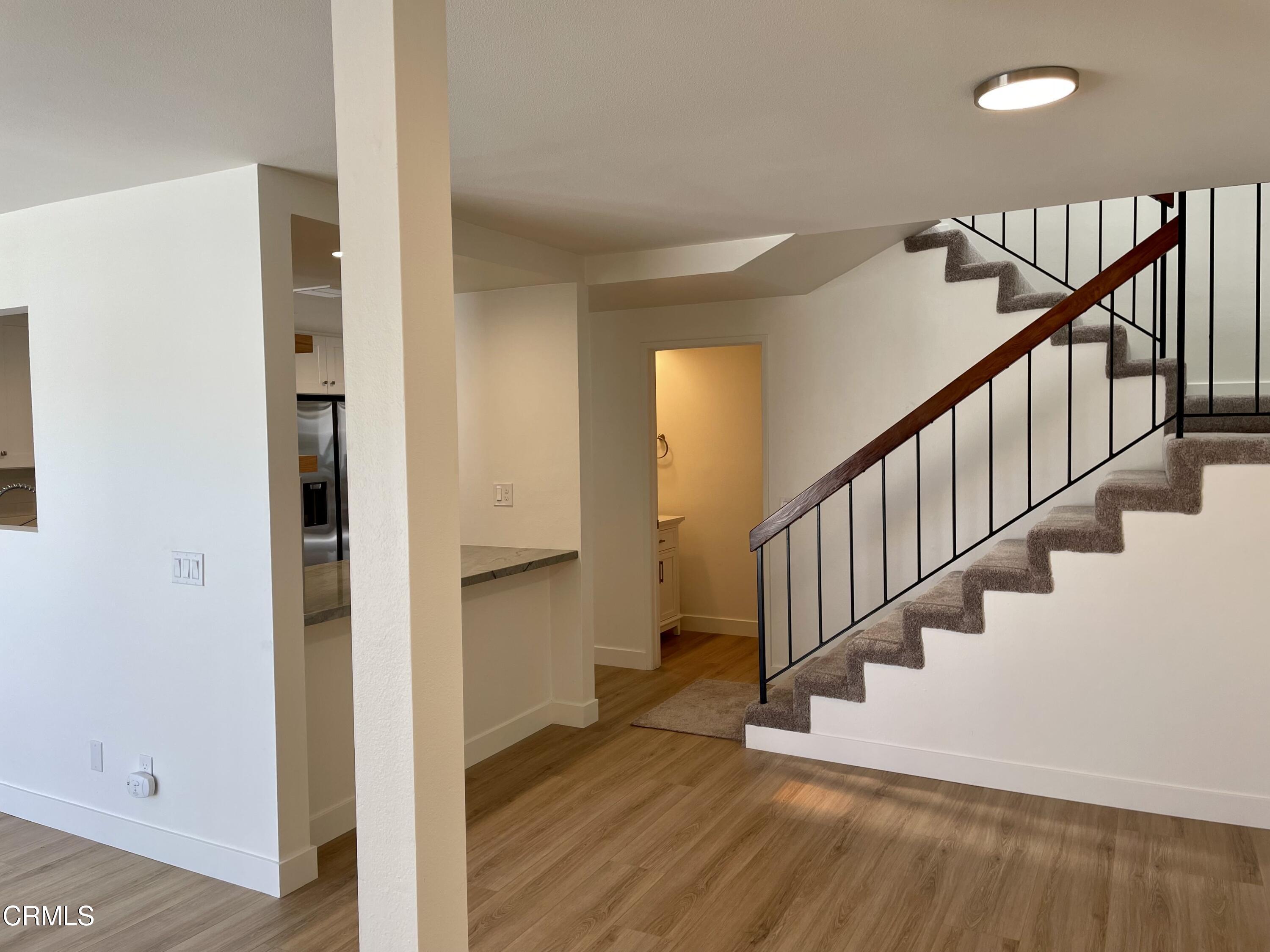 5115 Perkins Road Oxnard, CA 93033 - Photo 6 of 25 a view of entryway and hall with wooden floor
