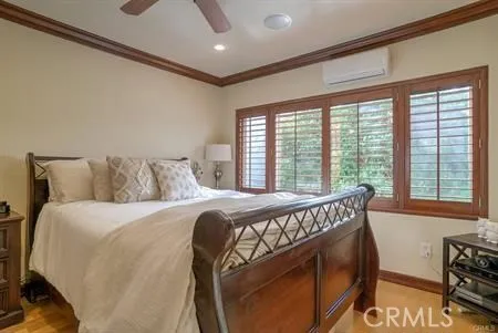 a bedroom with a bed a table and chair