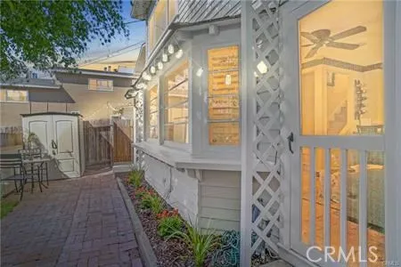 a view of a brick house with a large window