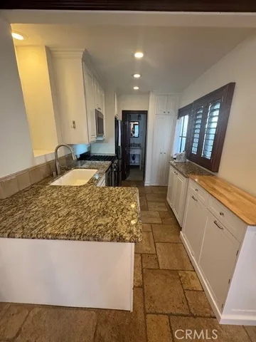 a view of living room with granite countertop furniture and fireplace