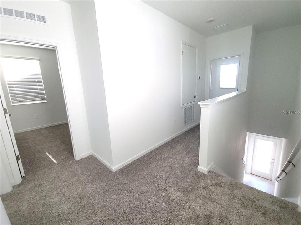 6182 Shavasana Road Clermont, FL 34714 - Photo 15 of 30 an empty room with windows and closet