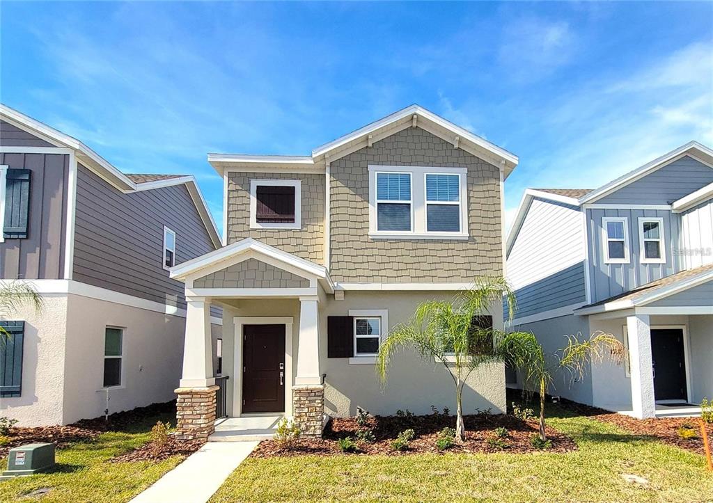 6182 Shavasana Road Clermont, FL 34714 - Photo 2 of 30 a view of a house with swimming pool and sitting area