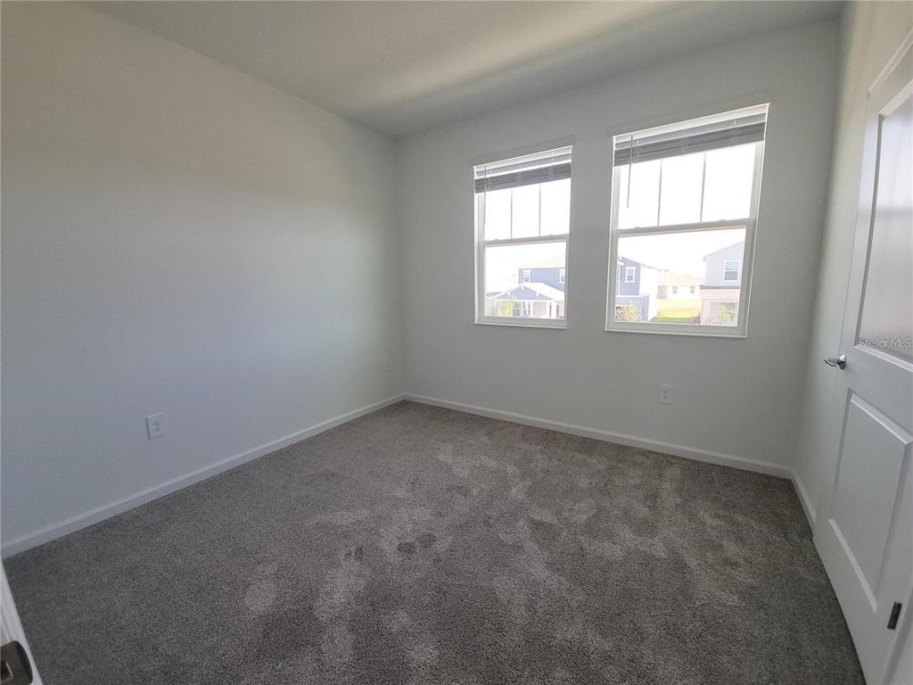 6182 Shavasana Road Clermont, FL 34714 - Photo 22 of 30 an empty room with a window