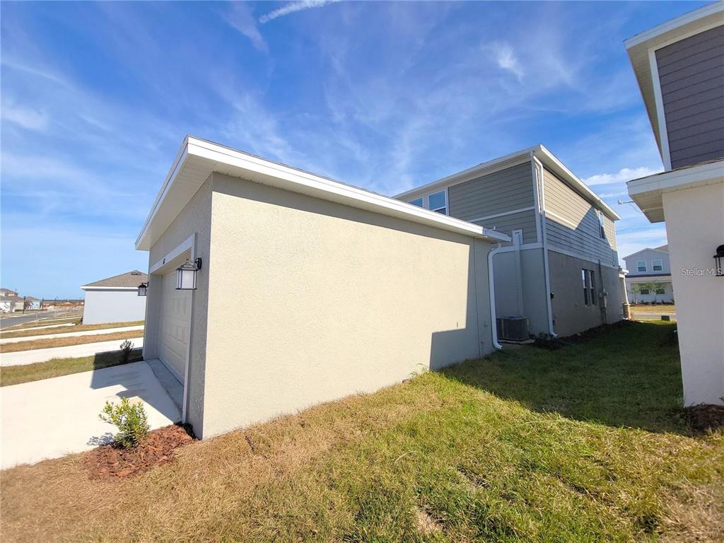 6182 Shavasana Road Clermont, FL 34714 - Photo 27 of 30 a house view with a backyard space