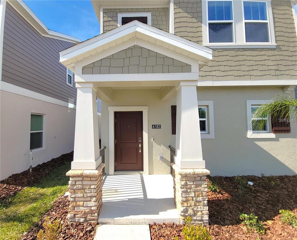 6182 Shavasana Road Clermont, FL 34714 - Photo 4 of 30 a front view of a house with a yard