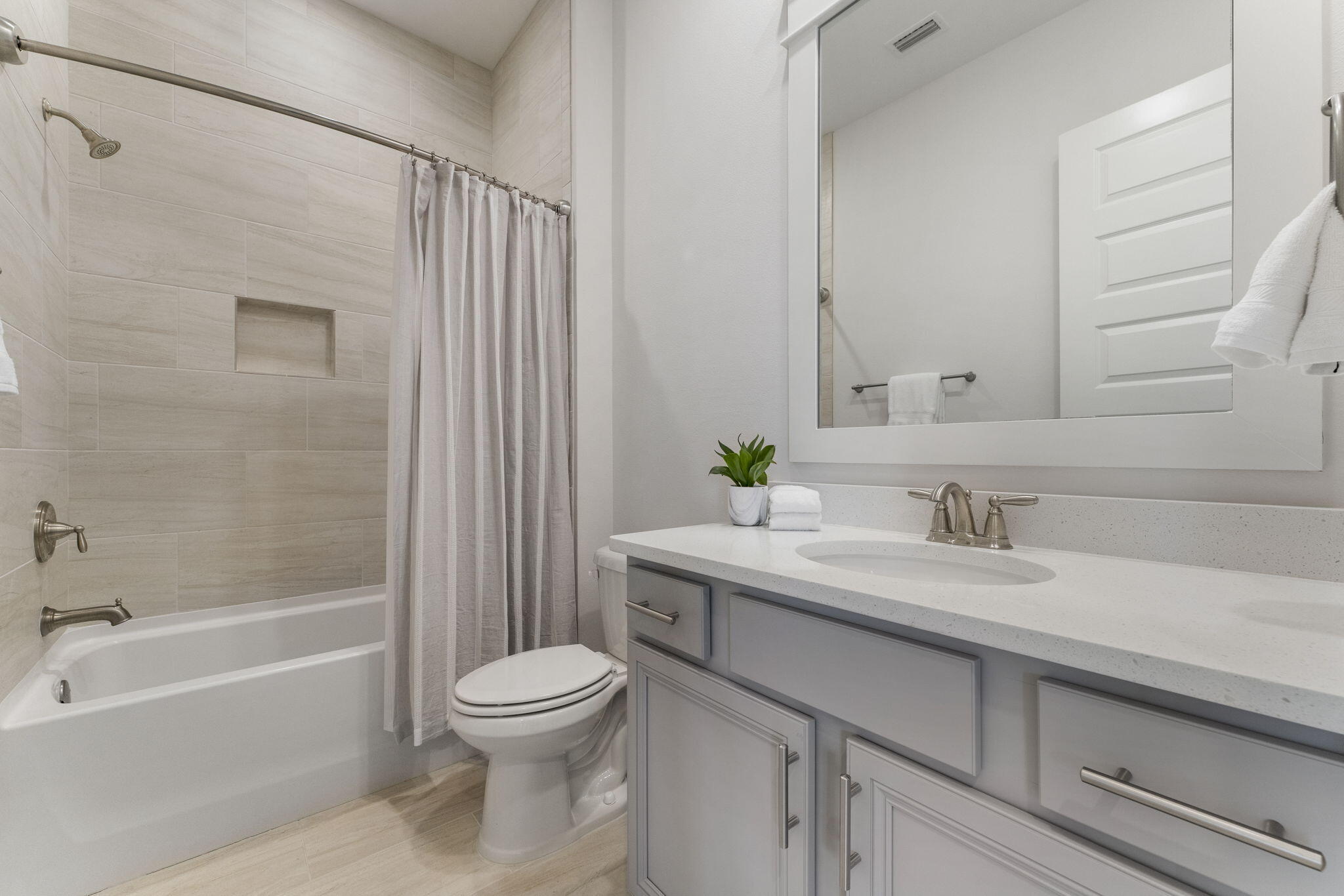 3 Milestone Drive, Unit C Inlet Beach, FL 32461 - Photo 26 of 47 a bathroom with a granite countertop sink toilet a mirror and shower
