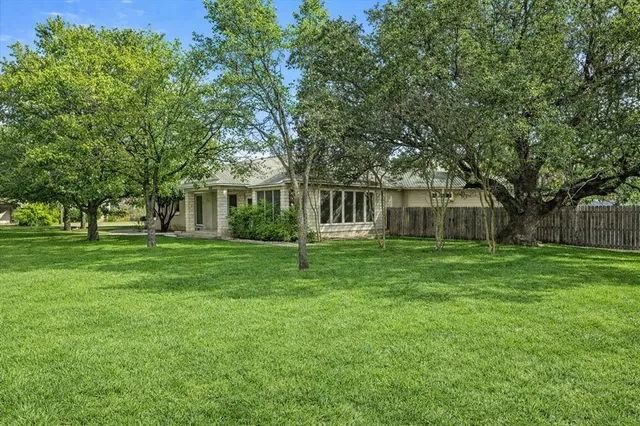 a view of a house with a big yard