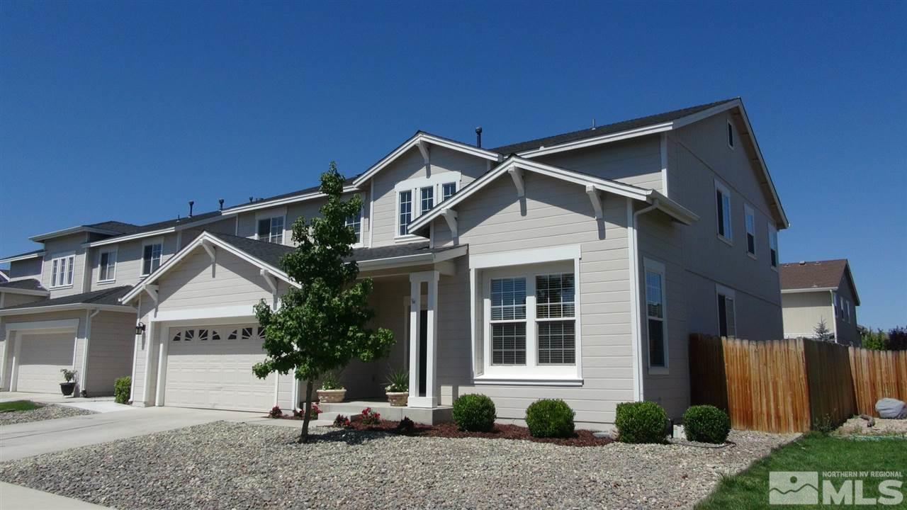 8921 Wynne Street Reno, NV 89506 - Photo 1 of 1 a front view of a house with a yard