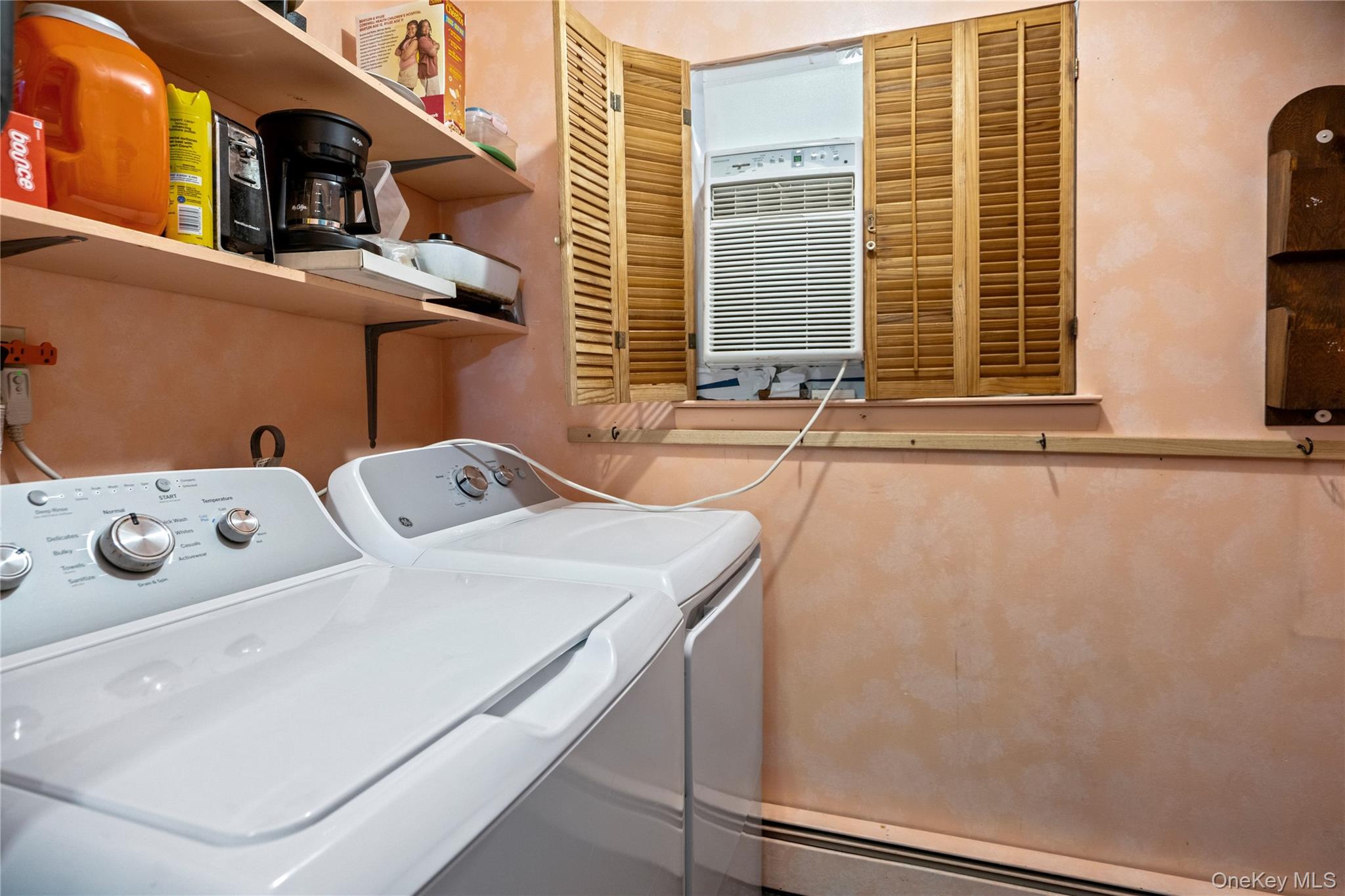 86 Cirrus Road Holbrook, NY 11741 - Photo 16 of 19 a utility room with dryer and washer