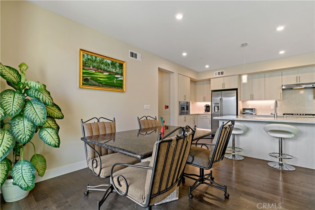 45009 Challenge Common, Unit 200 Fremont, CA 94538 - Photo 12 of 27 a view of a dining room with furniture and a potted plant