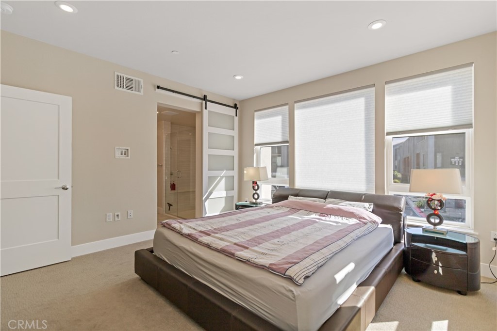 45009 Challenge Common, Unit 200 Fremont, CA 94538 - Photo 15 of 27 a bedroom with a bed and wooden floor