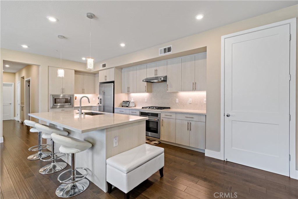 45009 Challenge Common, Unit 200 Fremont, CA 94538 - Photo 9 of 27 a kitchen with white cabinets and sink