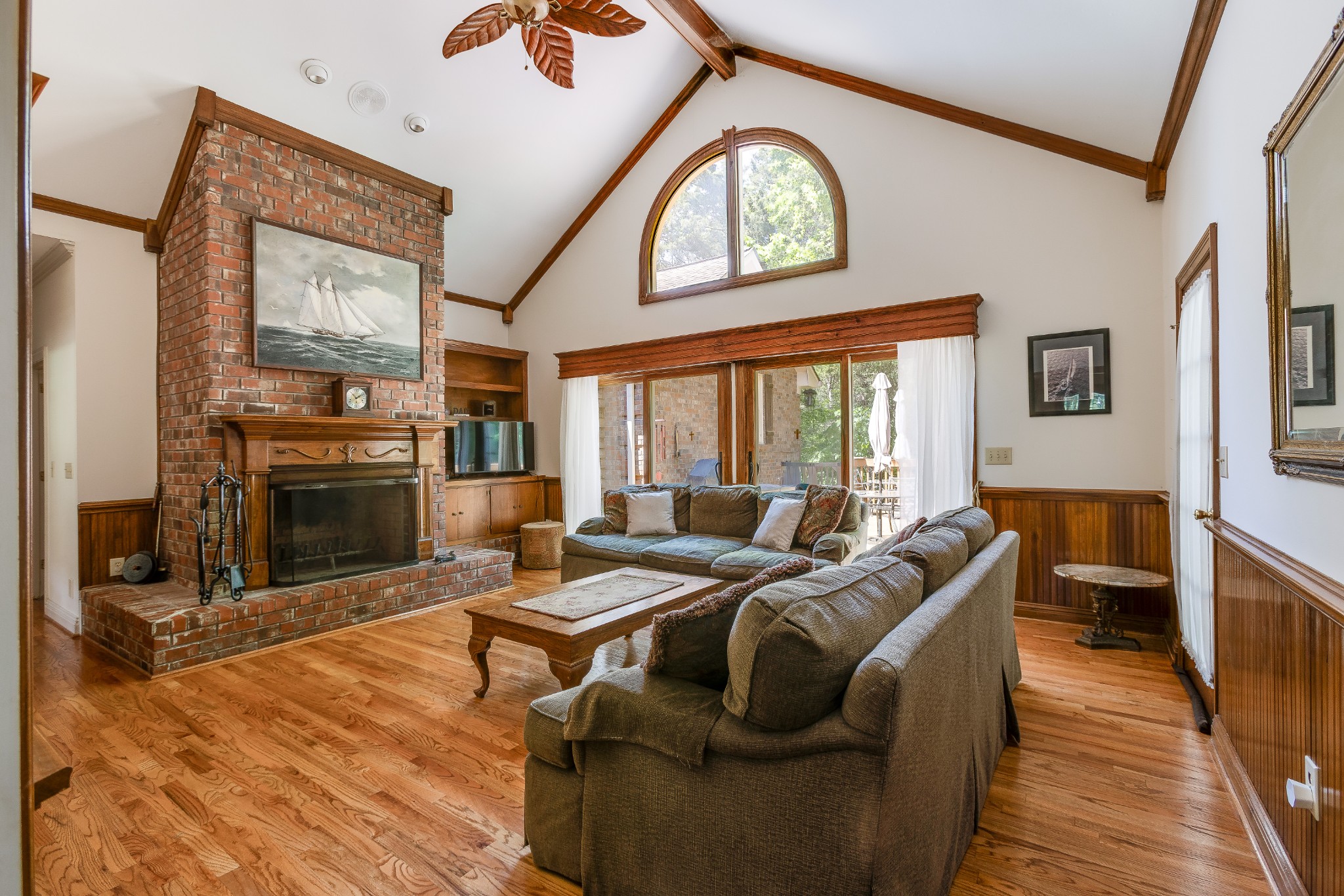 1111 Temple Ridge Court Nashville, TN 37221 - Photo 25 of 46 a living room with furniture a large window and a fireplace
