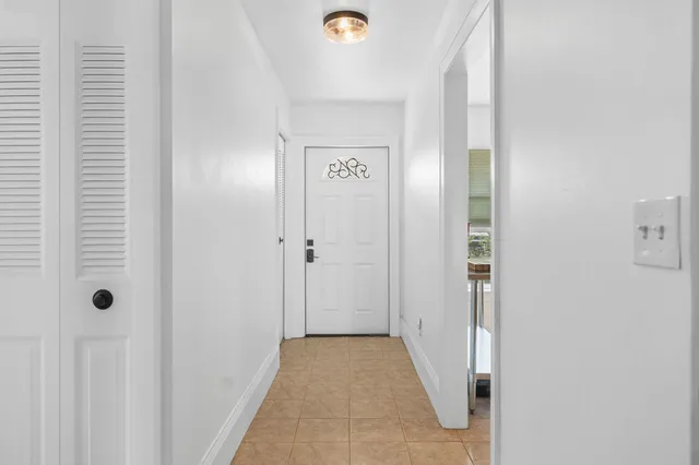 a kitchen with a sink stove top oven and refrigerator