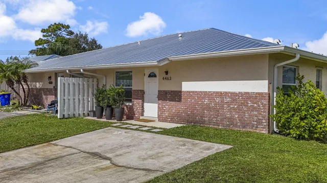 an aerial view of house with yard swimming pool and outdoor seating