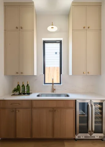 a kitchen with stainless steel appliances a sink and cabinets