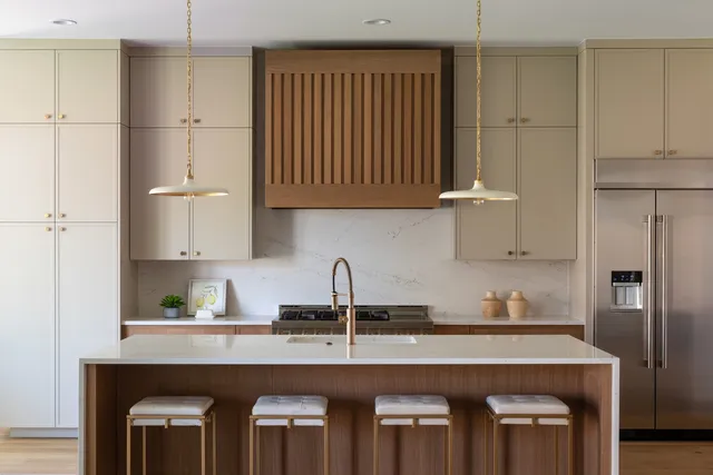 a living room with furniture potted plant and wooden floor