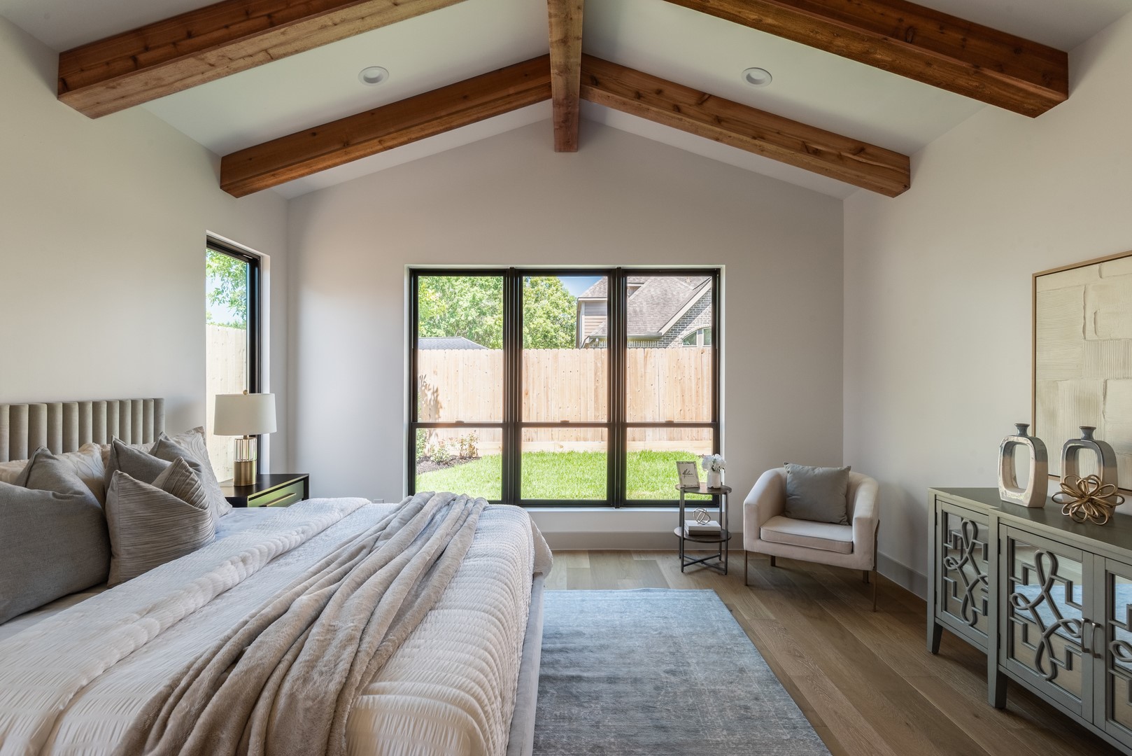 1310 Chantilly Lane Houston, TX 77018 - Photo 16 of 26 a bedroom with a bed a couch and a window
