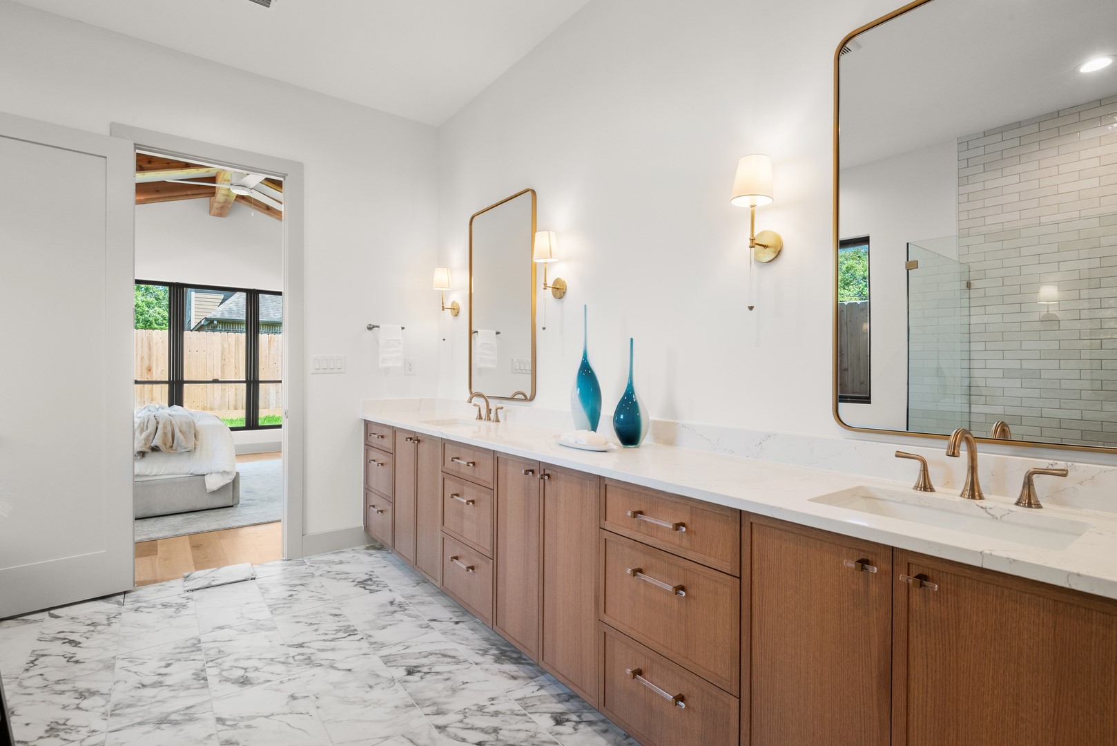 1310 Chantilly Lane Houston, TX 77018 - Photo 17 of 26 a spacious bathroom with a double vanity sink and a mirror