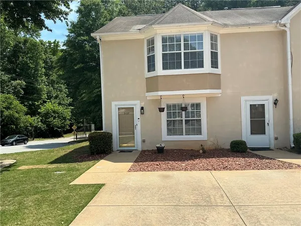 a front view of a house with a yard
