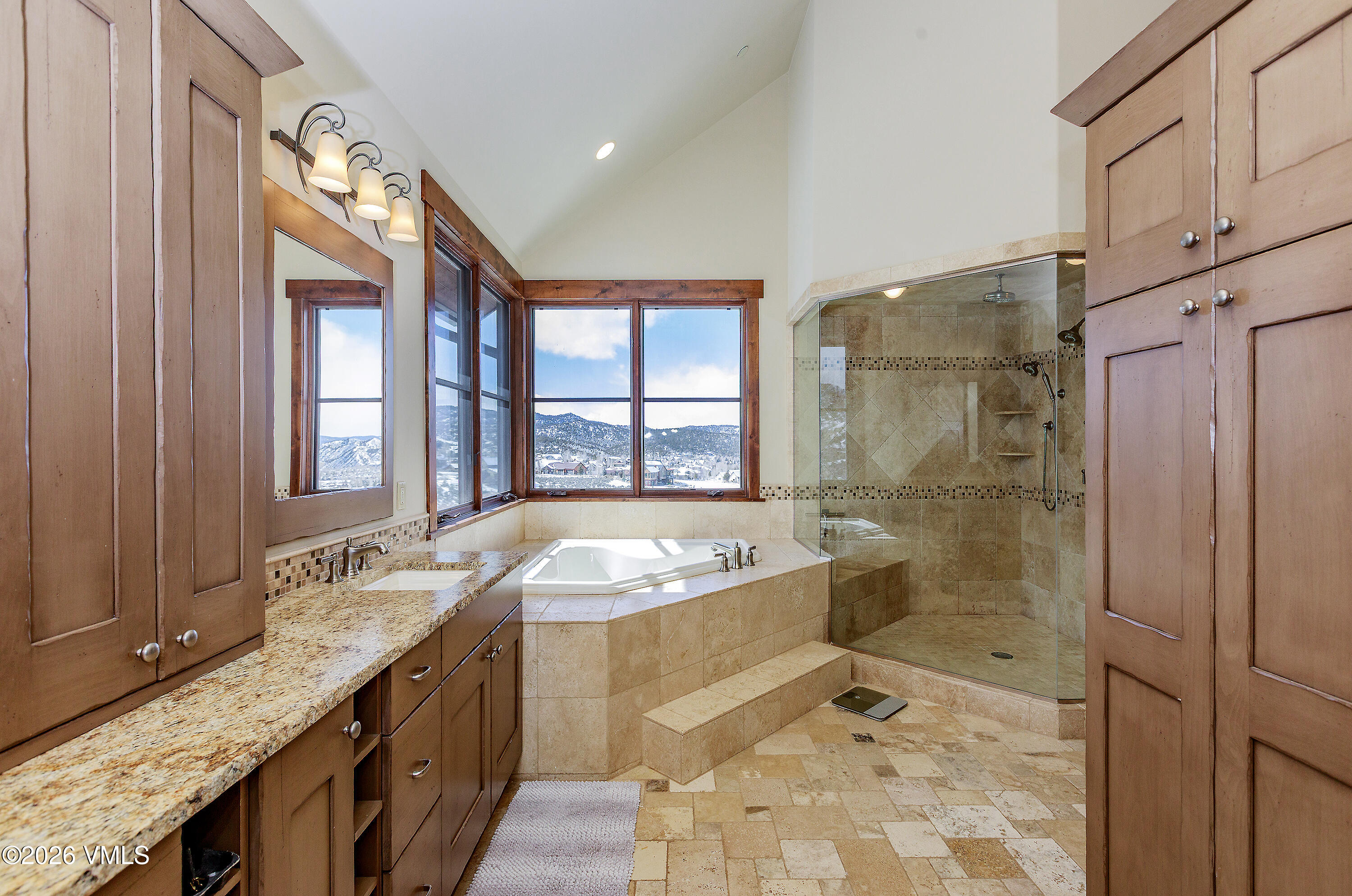 2753 East Haystacker Drive Eagle, CO 81631 - Photo 24 of 41 a spacious bathroom with a granite countertop tub sink a mirror a shower and a bath tub