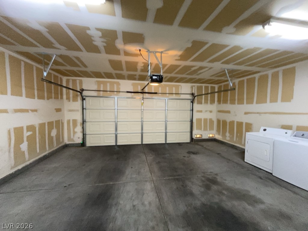 4915 East Russell Road, Unit 145 Las Vegas, NV 89120 - Photo 12 of 13 Garage with separate washer and dryer and a garage door opener