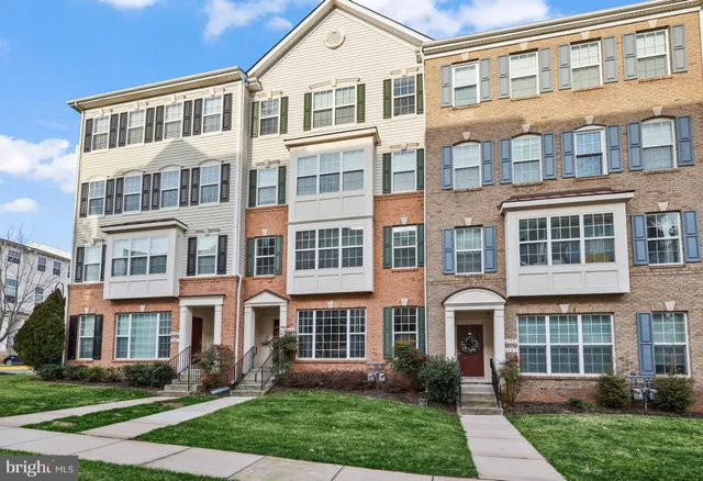 a front view of a house with garden and porch