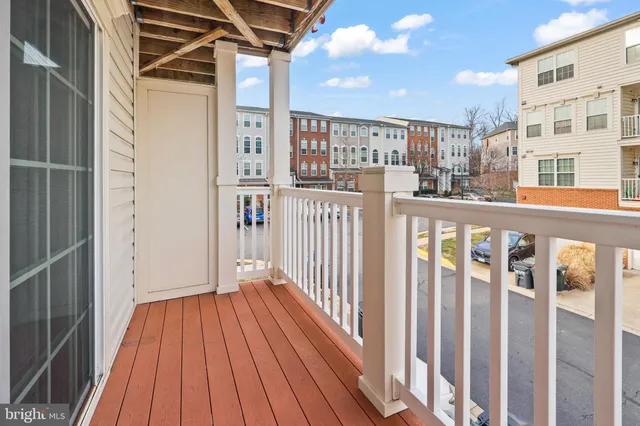a view of a balcony with wooden floor