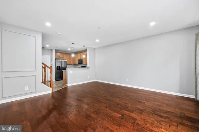 a view of a kitchen with a sink and a stove top oven