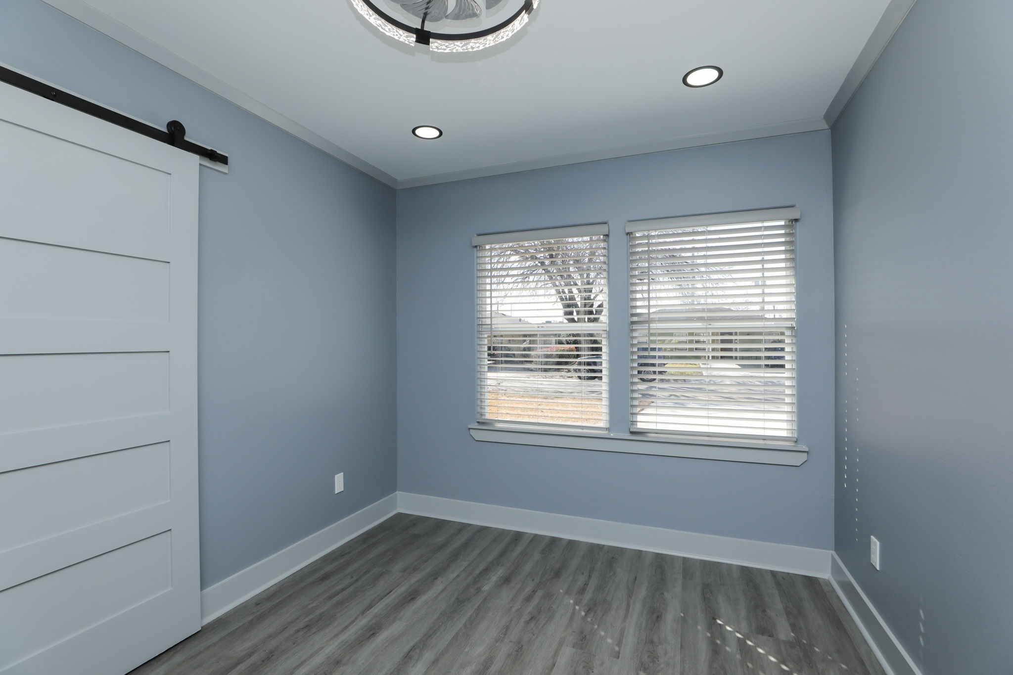 4047 Juliet Street Houston, TX 77087 - Photo 28 of 38 a view of an empty room with a window and wooden floor