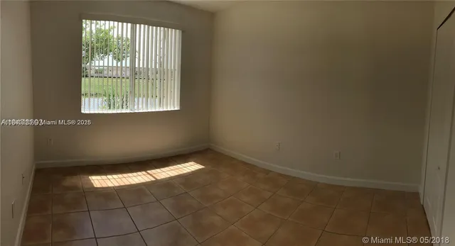 $329,000 | 17720 Northwest 73rd Avenue, Unit 105, Hialeah, FL 33015