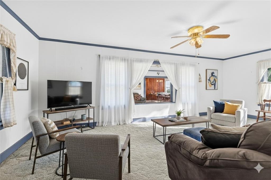 219 Meridian Road Butler, PA 16001 - Photo 15 of 39 a living room with furniture and a flat screen tv