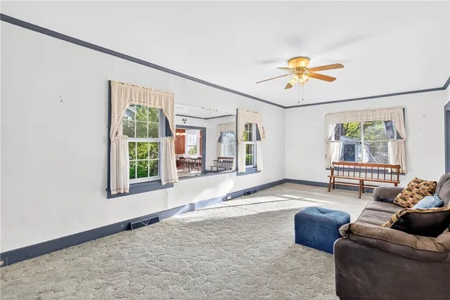 a living room with furniture and a window