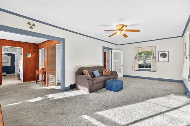 a living room with furniture and view of living room