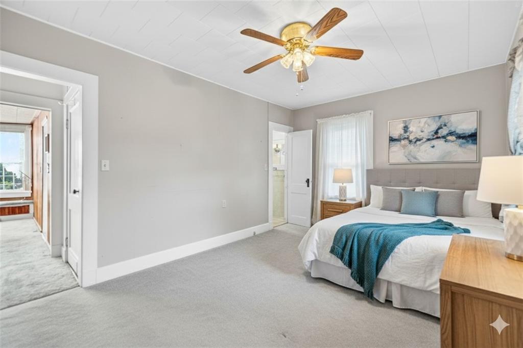 219 Meridian Road Butler, PA 16001 - Photo 19 of 39 a bedroom with a bed and a chandelier