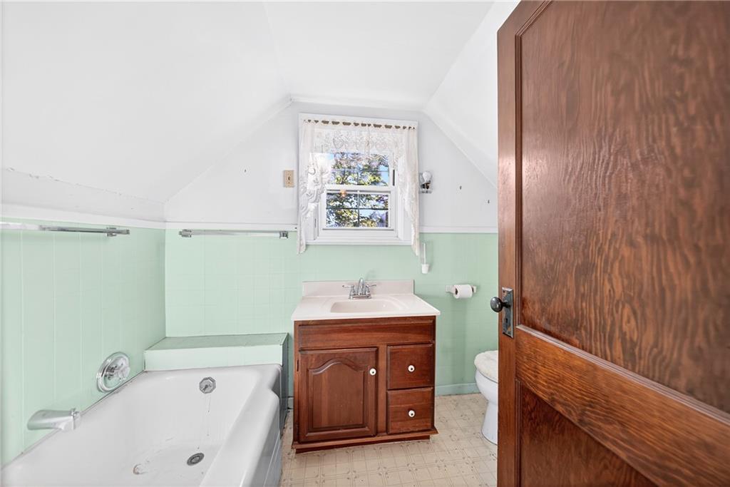219 Meridian Road Butler, PA 16001 - Photo 27 of 39 a bathroom with a bathtub and a sink