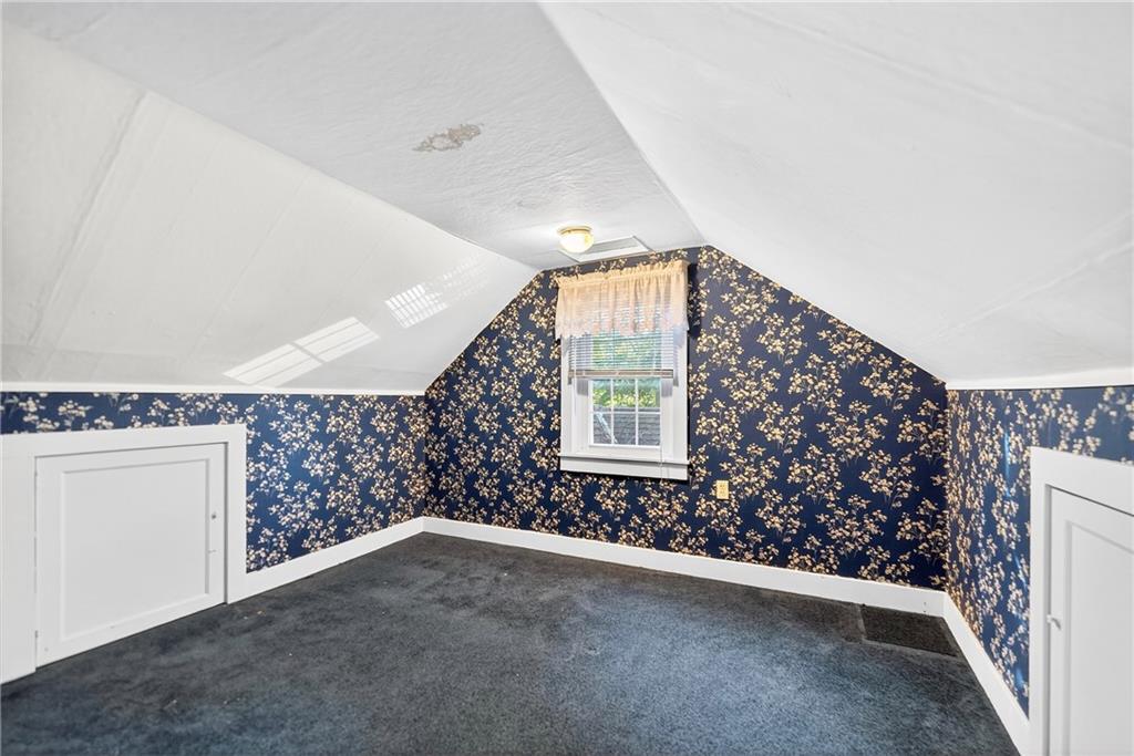 219 Meridian Road Butler, PA 16001 - Photo 29 of 39 a view of a livingroom with wooden floor and a ceiling fan