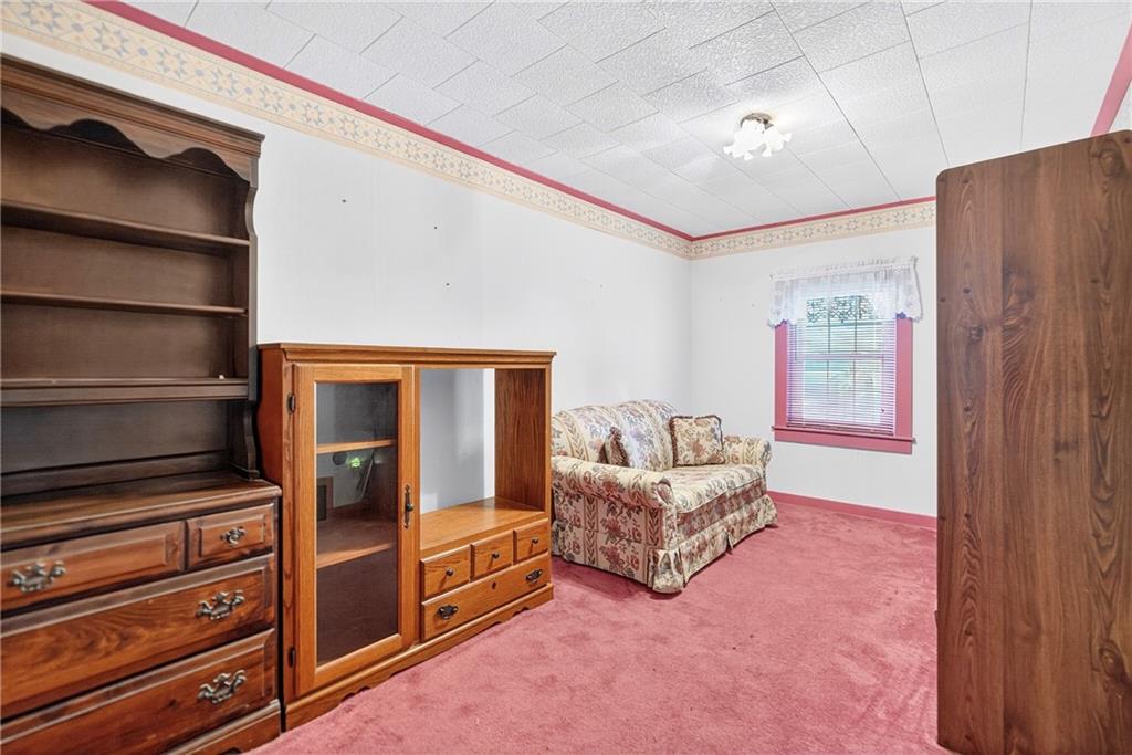 219 Meridian Road Butler, PA 16001 - Photo 31 of 39 a living room with furniture and a dresser