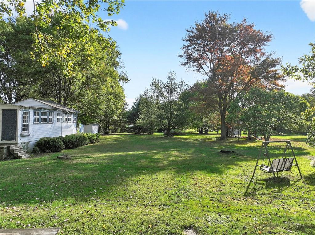 219 Meridian Road Butler, PA 16001 - Photo 34 of 39 a backyard of a house with lots of green space