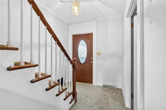 a view of front door with stairs