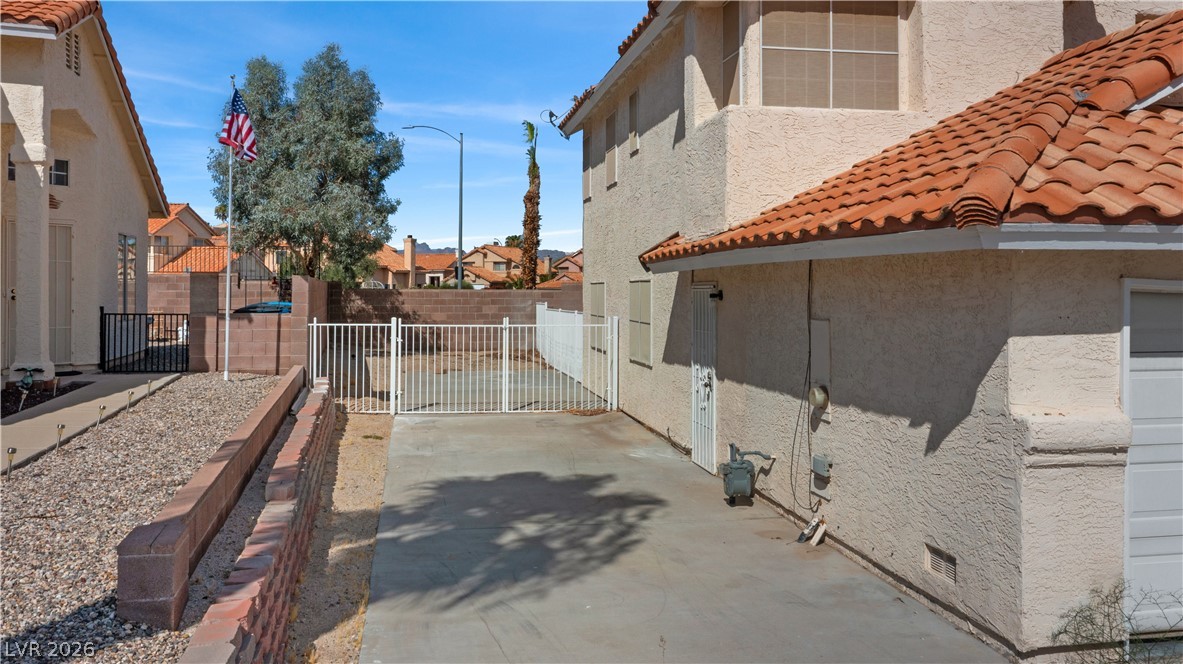 3156 Terrace View Drive Laughlin, NV 89029 - Photo 76 of 94 A terracotta-tiled roof crowns this residence, featuring a secure gated yard and well-maintained hardscaping.