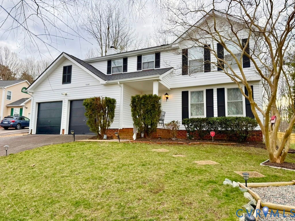 9643 Snowhill Road Richmond, VA 23235 - Photo 1 of 30 a front view of house with yard and green space
