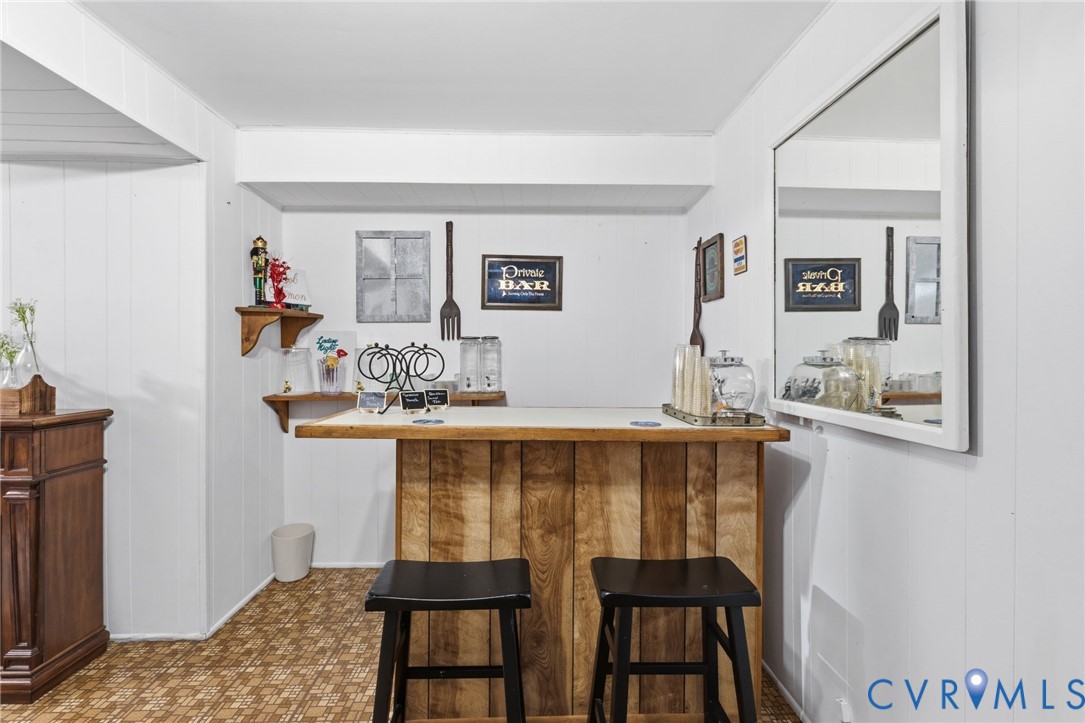 9643 Snowhill Road Richmond, VA 23235 - Photo 23 of 30 a dining room with table and chairs